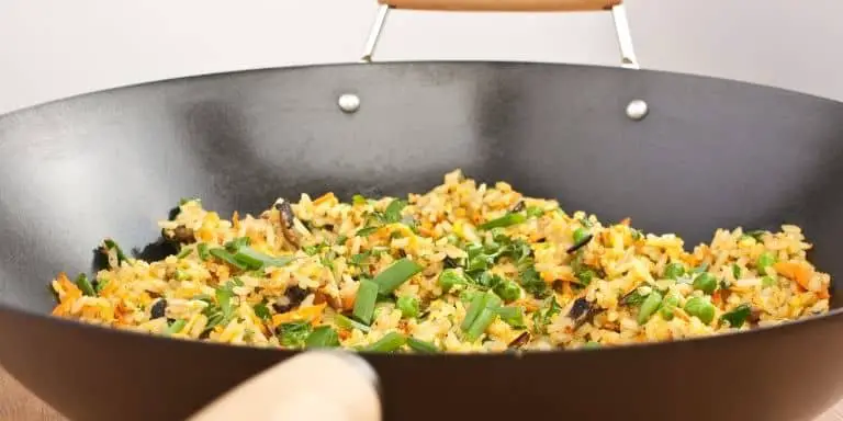 Egg fried rice in a pan on a stovetop