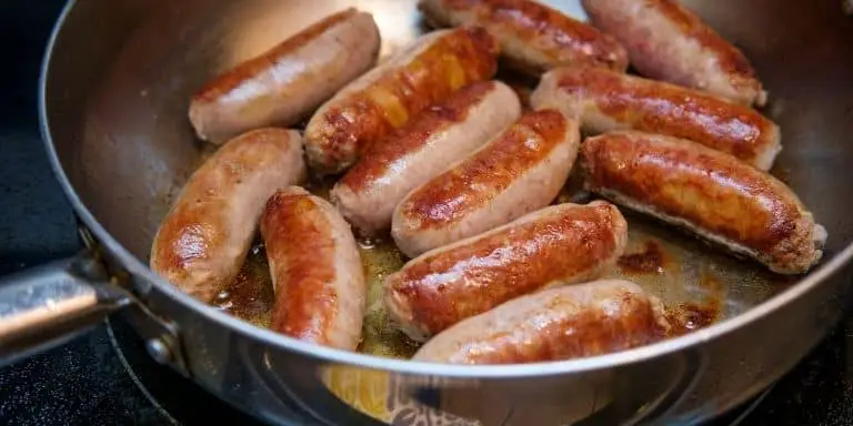 Heating sausages in a pan