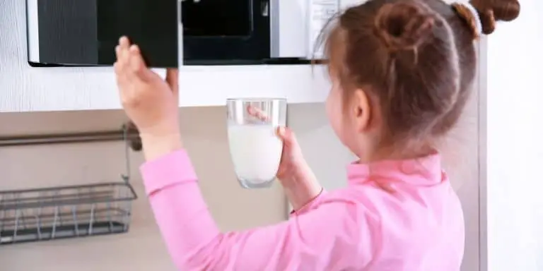 Putting a glass of milk in the microwave