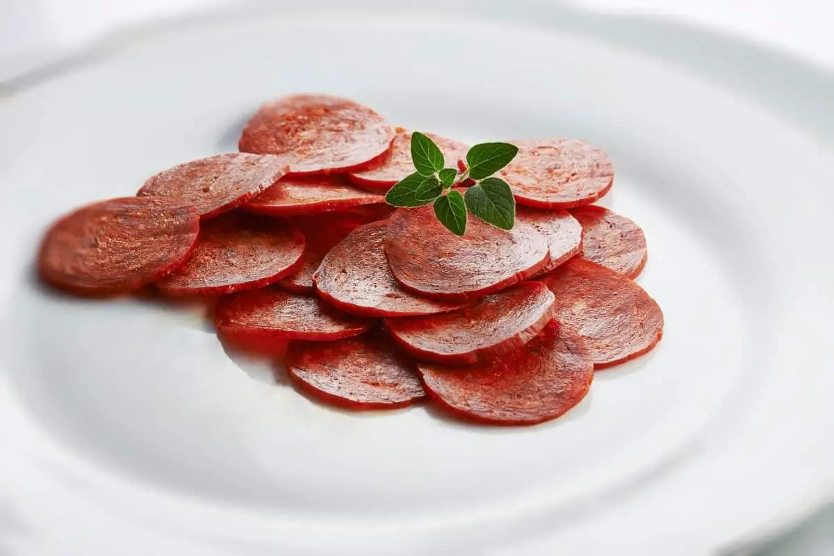 Sliced pepperoni on a plate