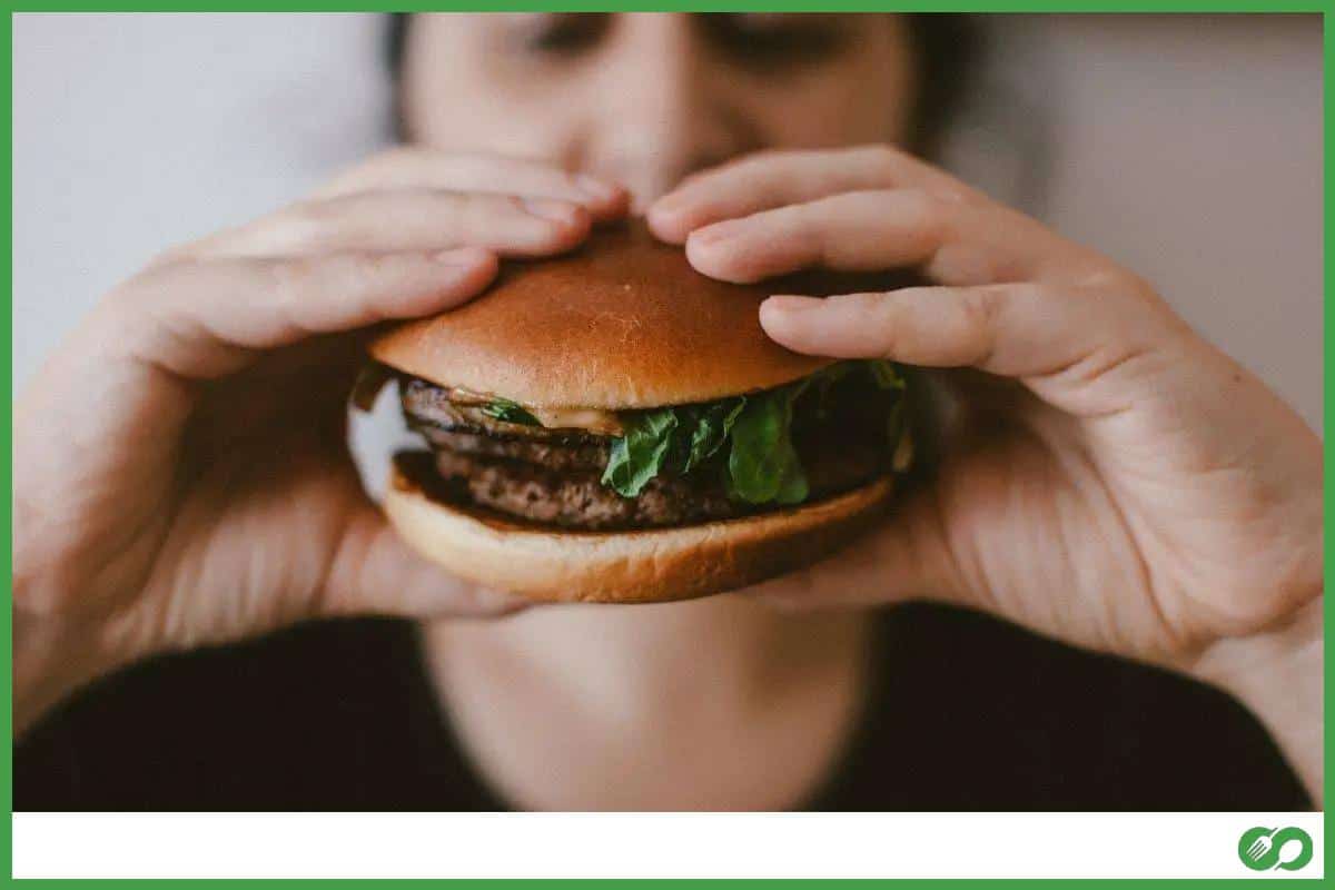 Person holding a hamburger