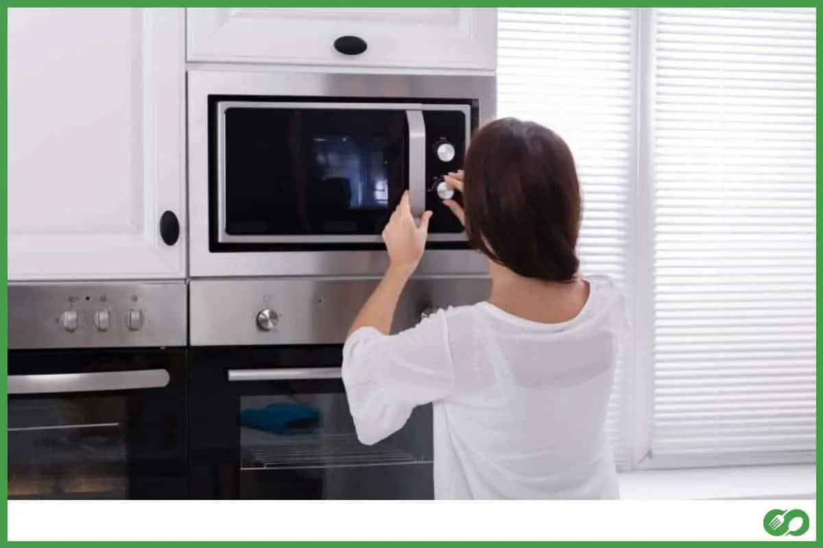 Woman using the microwave
