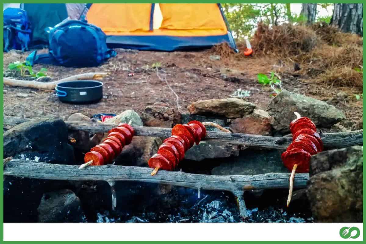 reheat sausages over fire while camping