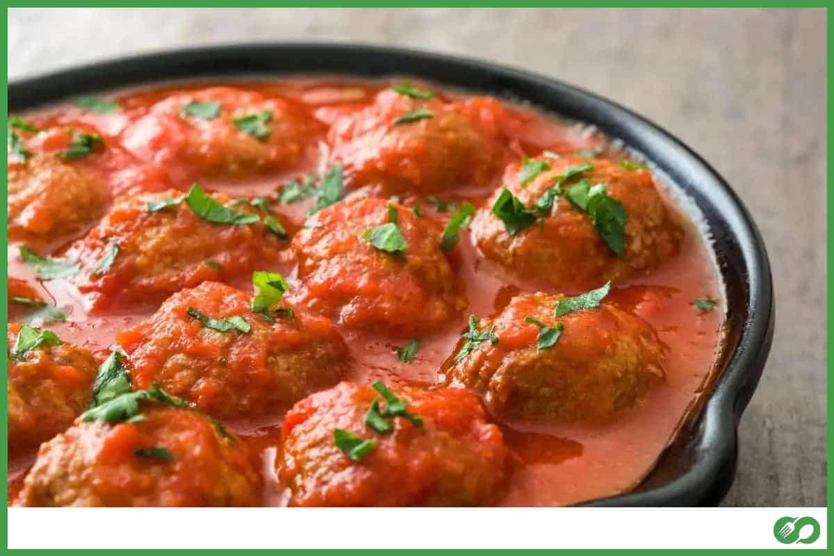 Meatballs with tomato sauce in a frying pan